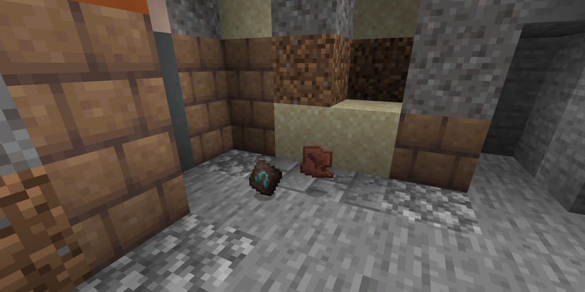 A smithing template and a pottery shard next to Trail Ruins in Minecraft