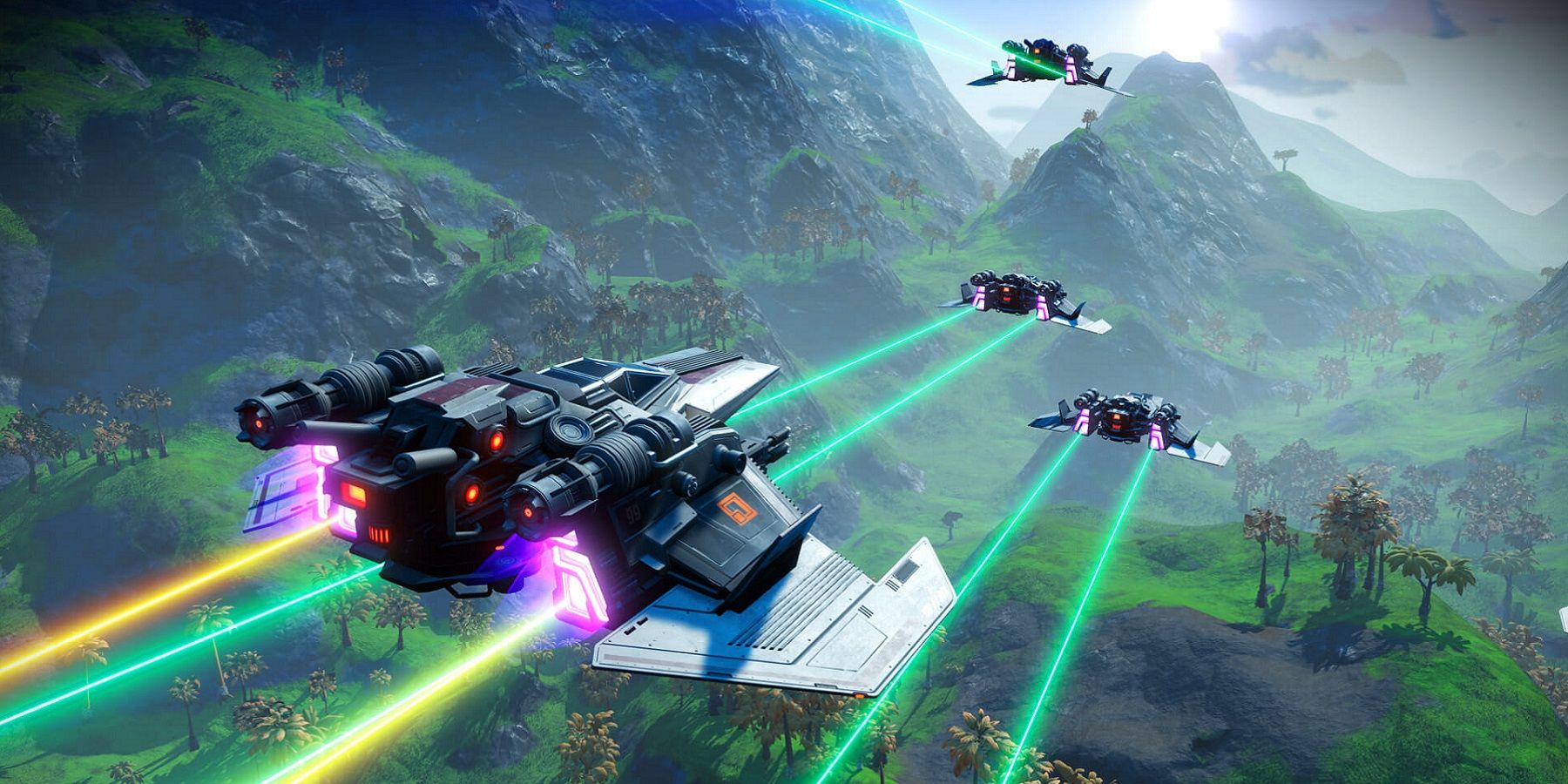 Image from No Man's Sky showing several spaceships leaving colorful trails as they fly over mountains.
