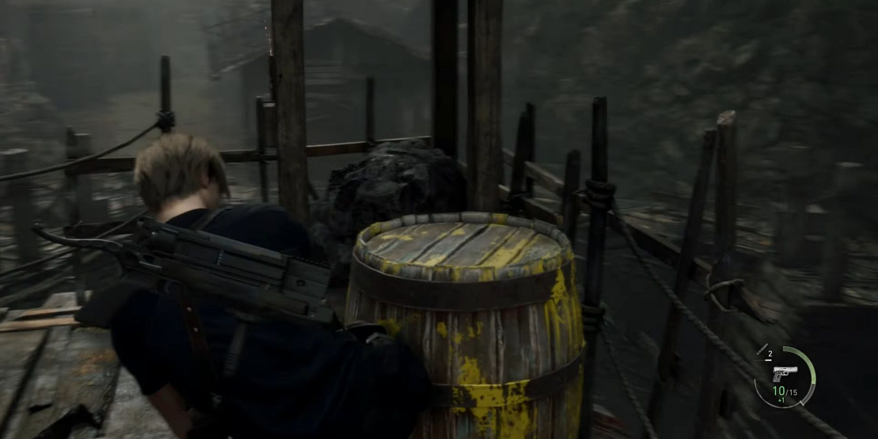 Leon kicking a barrel in Resident Evil 4 Remake.