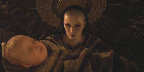 Mother Miranda holding baby Rose in Resident Evil Village