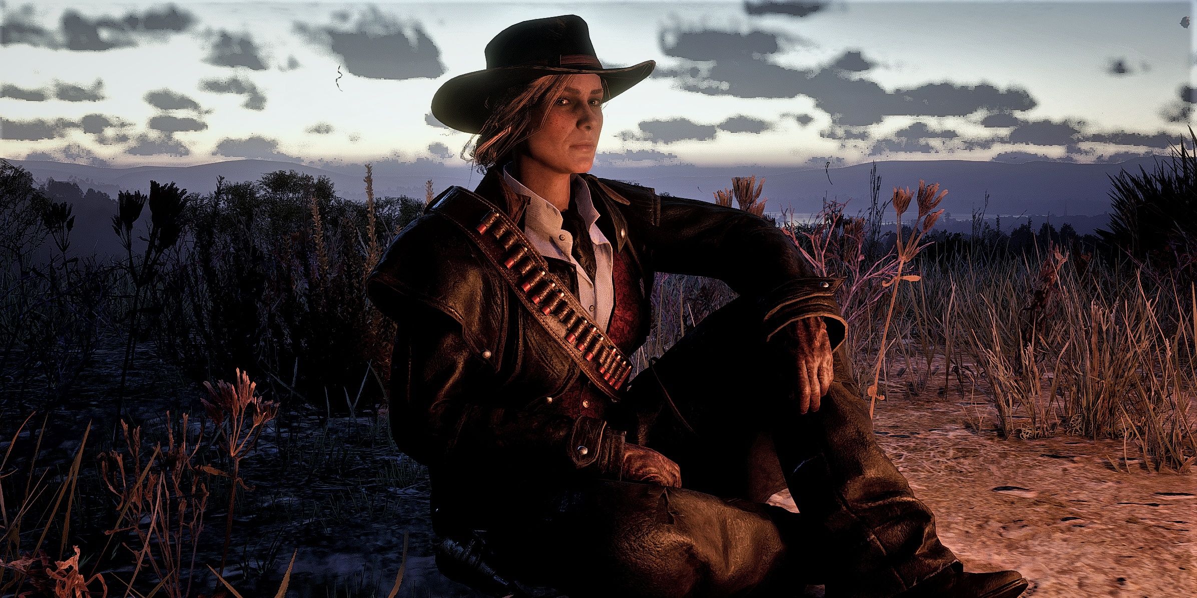 Sadie Adler duduk di Red Dead Redemption 2