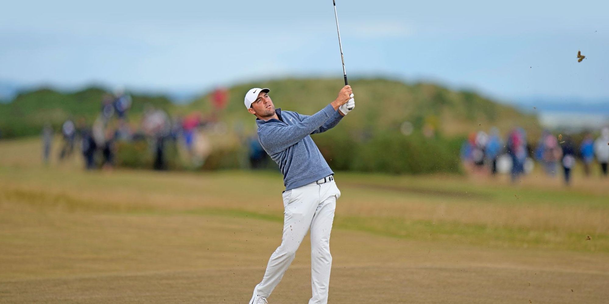 PGA Pro Golfer Scottie Scheffler posing after a shot