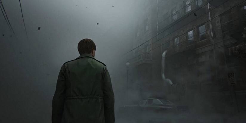 Image from the Silent Hill 2 remake showing James Sunderland walking through the titular foggy town.