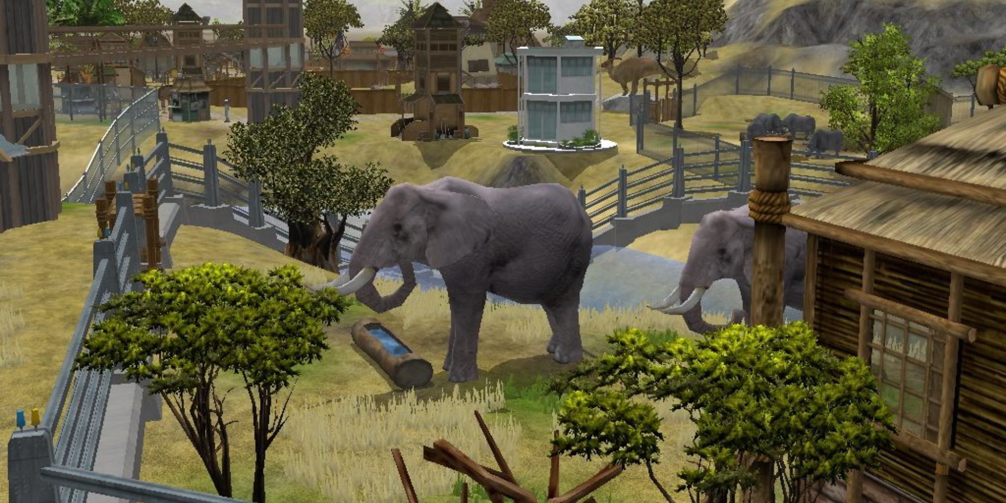 Two elephants in a zoo enclosure, Wildlife Park 2