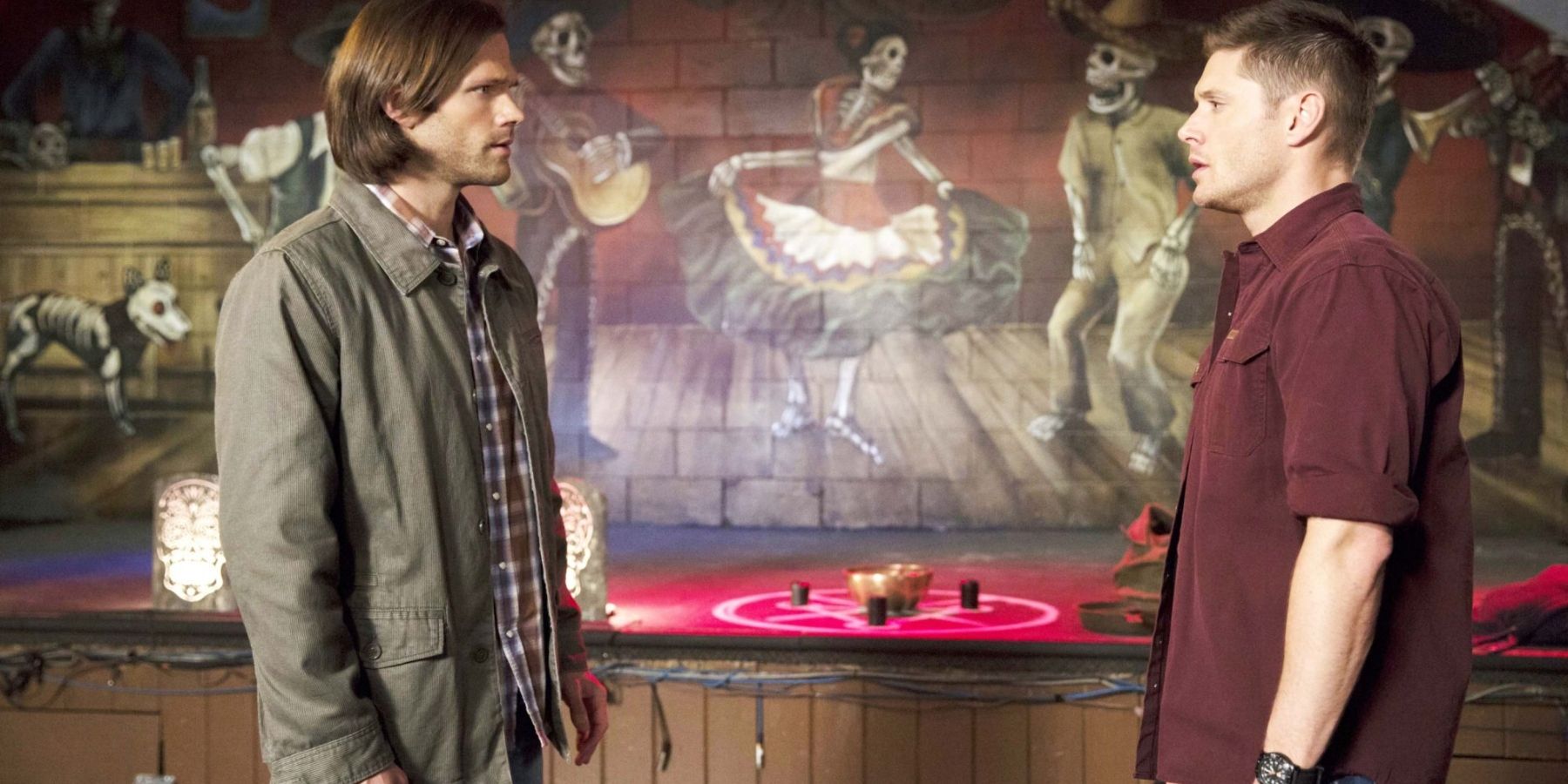 Sam and Dean talking in a bar in Supernatural