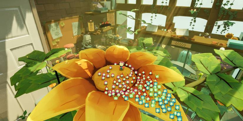 Milo and an army of Tinykin sitting on a giant sunflower in Tinykin