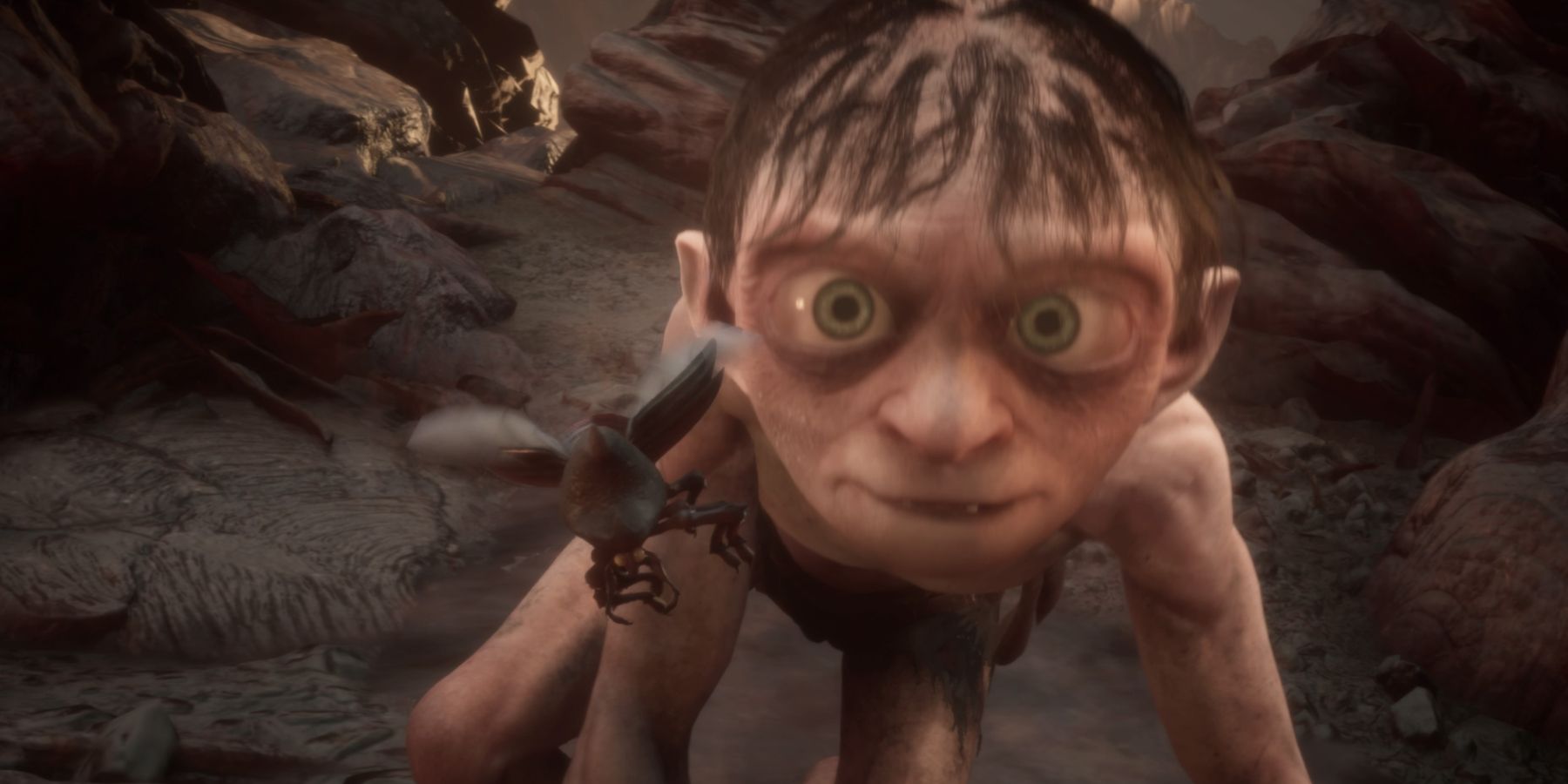 Gollum approaches a bug in The Lord of the Rings: Gollum