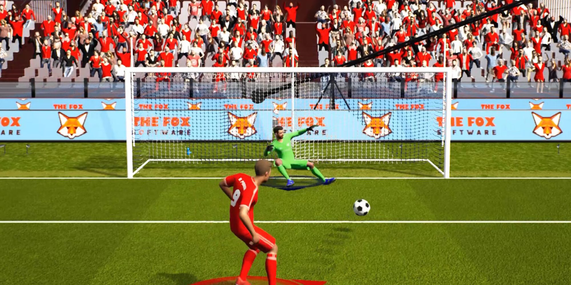 Soccer player shoots the ball toward the gate defended by a sliding goalkeeper