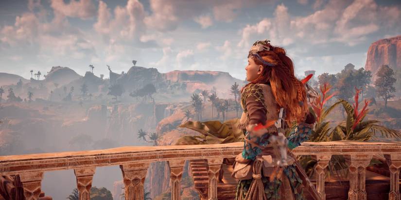 Aloy taking in the view from the Palace of the Sun in Meridian in Horizon Zero Dawn