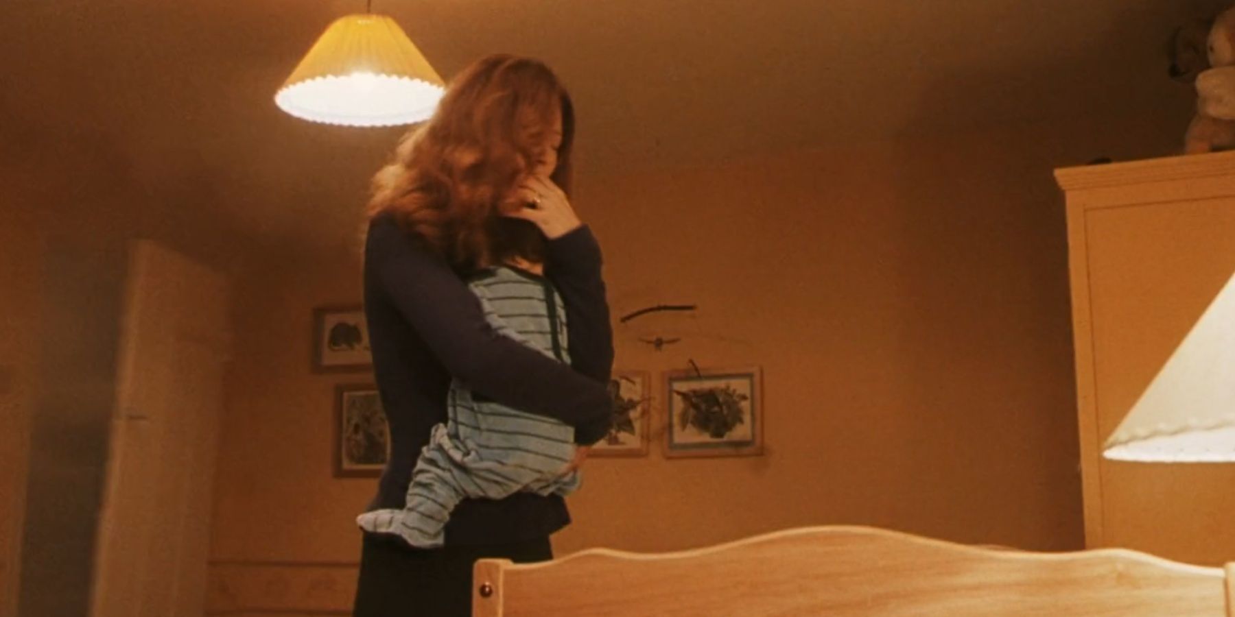 Lily Potter holds little Harry in Harry Potter and the Philosopher's Stone.