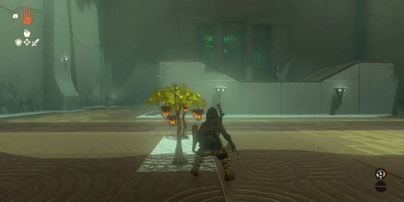 Link stands next to a Fire Fruit tree in the Yamiyo Shrine in Tears of the Kingdom