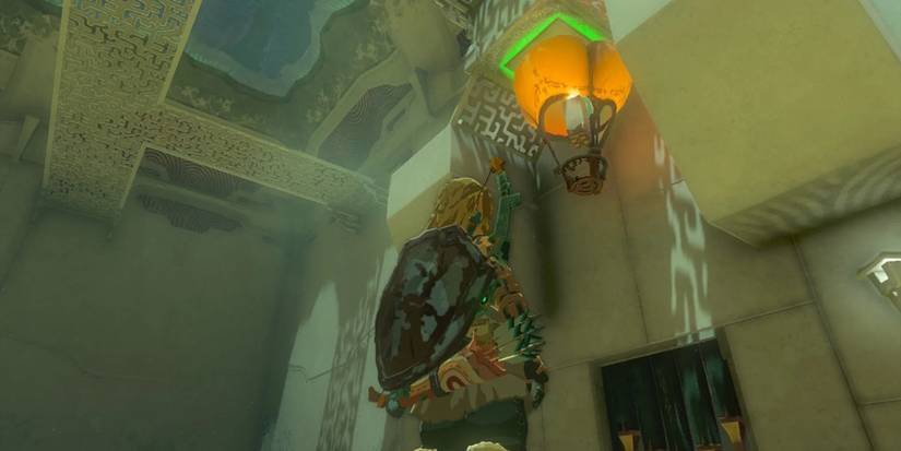 Link uses a balloon device to press a button in the Sinakawak Shrine in Tears of the Kingdom