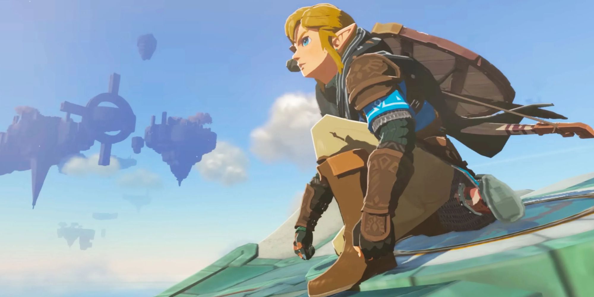 Link crouches on a Zonai Wing midair in Tears of the Kingdom