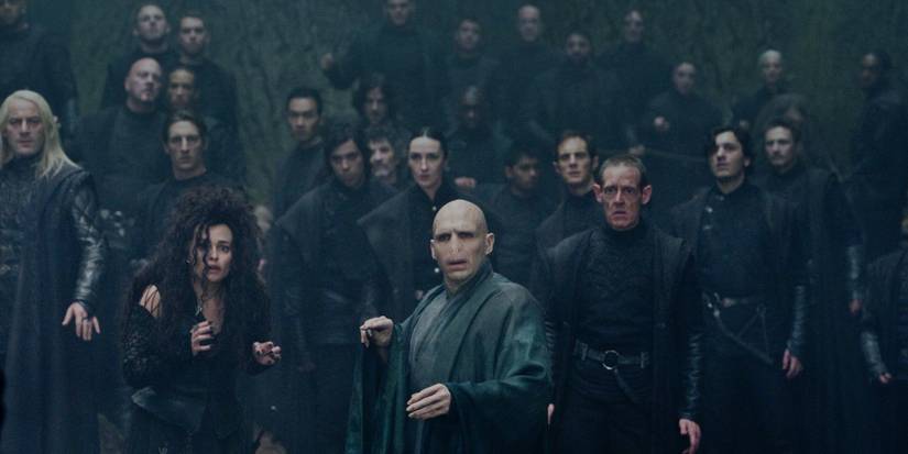 Death Eaters standing behind Voldemort in Harry Potter