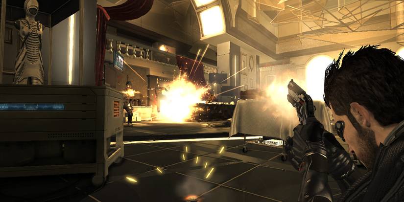 Jensen firing at foes in a futuristic building.