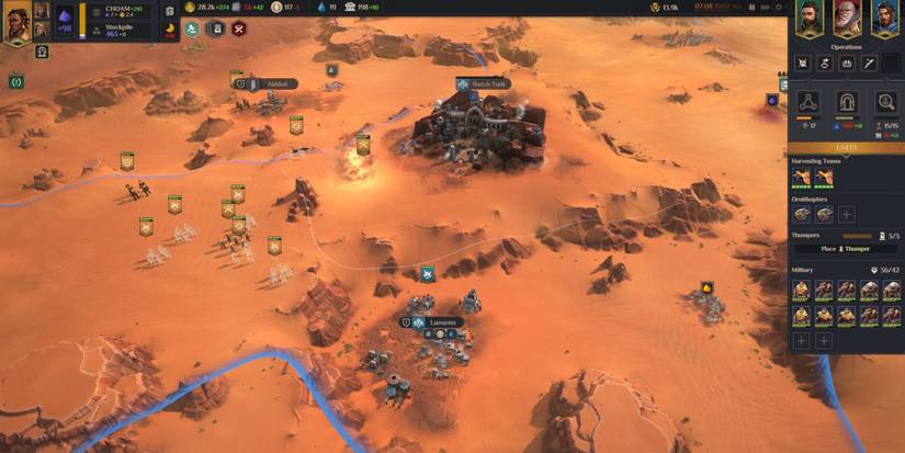 A player with a lot of units near a base in Dune: Spice Wars