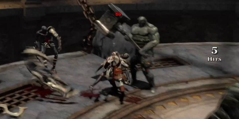 God of war 3 kratos runs with a sentry