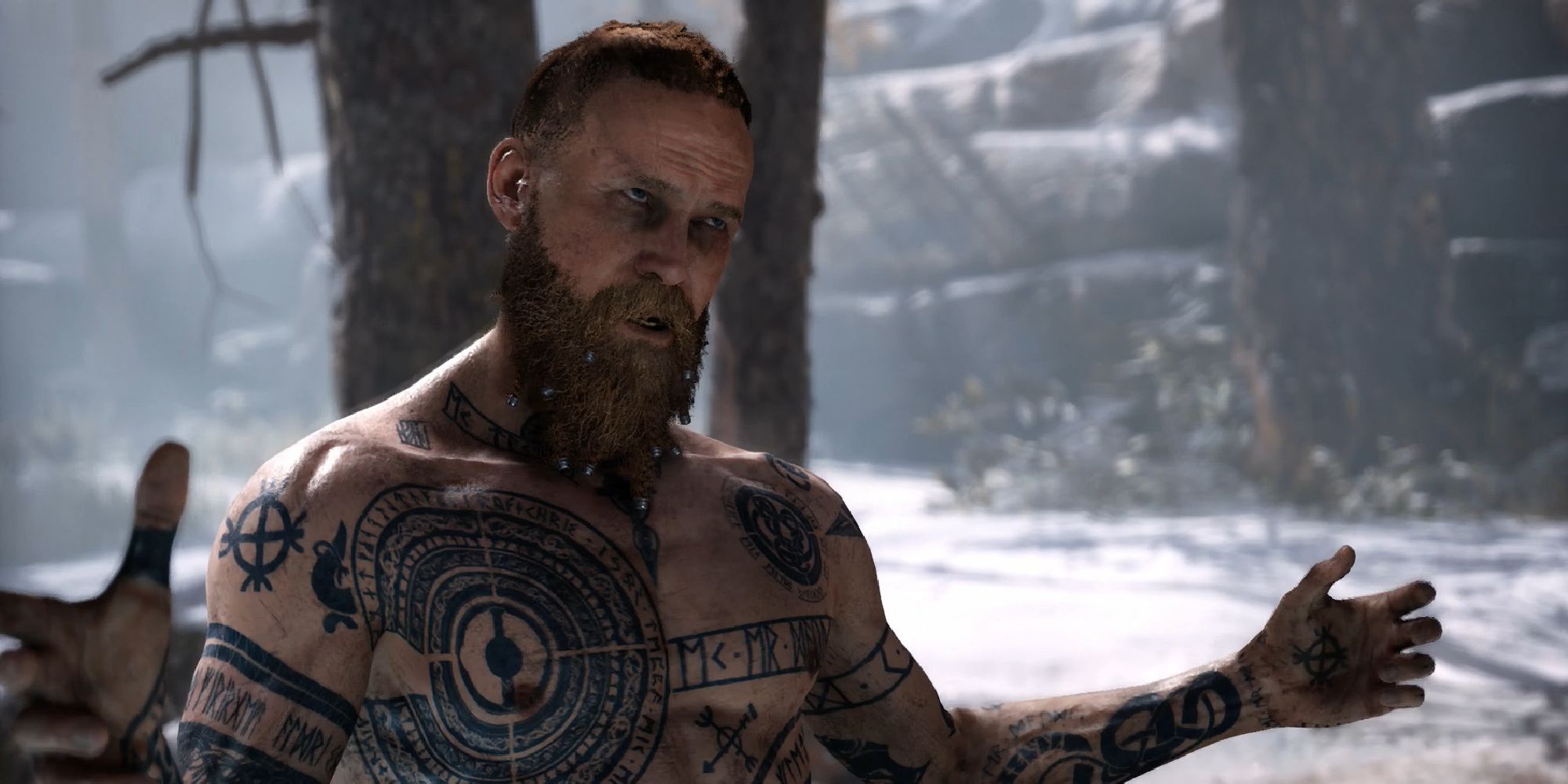 Baldur from God of War, addressing an unseen person with his hands spread. His exposed chest and arms are a gallery of tattoos. 