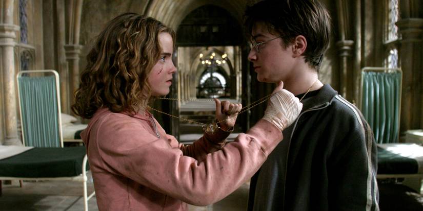 Hermion putting the chain for the time-turner around herself and Harry in Harry Potter and the Prisoner of Azkaban