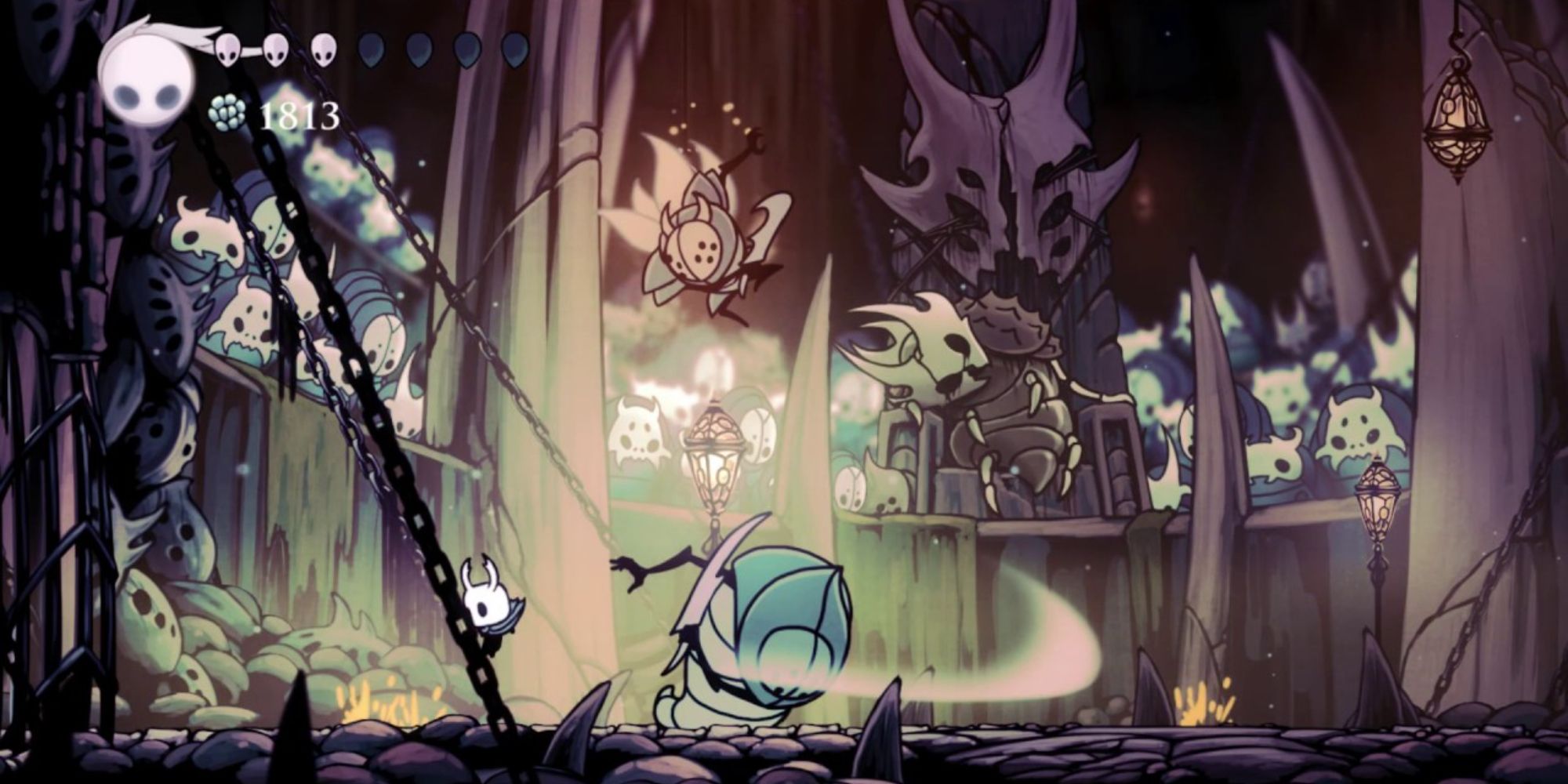 Hollow Knight fighting a bug monster