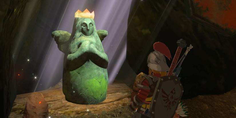 Link looking at Hylia statue