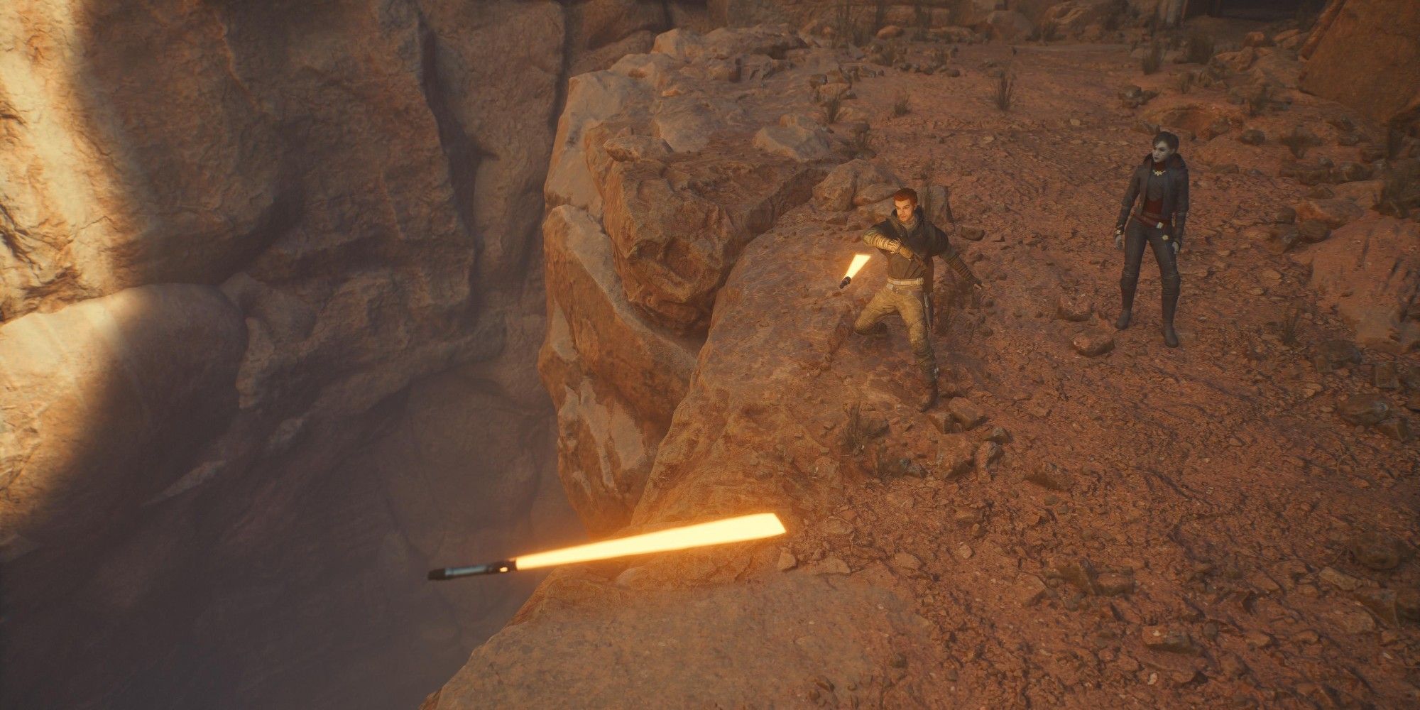 cal throwing two lightsabers on jedha