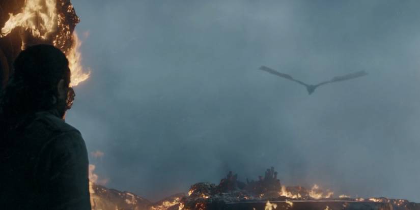 Jon Snow watches Drogon fly away with Daenerys' body in Game of Thrones.