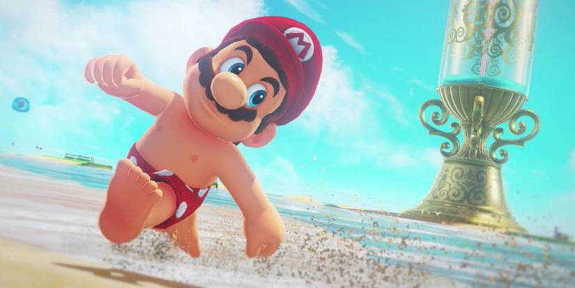Mario running in his bathing suit on a beach in Super Mario Odyssey