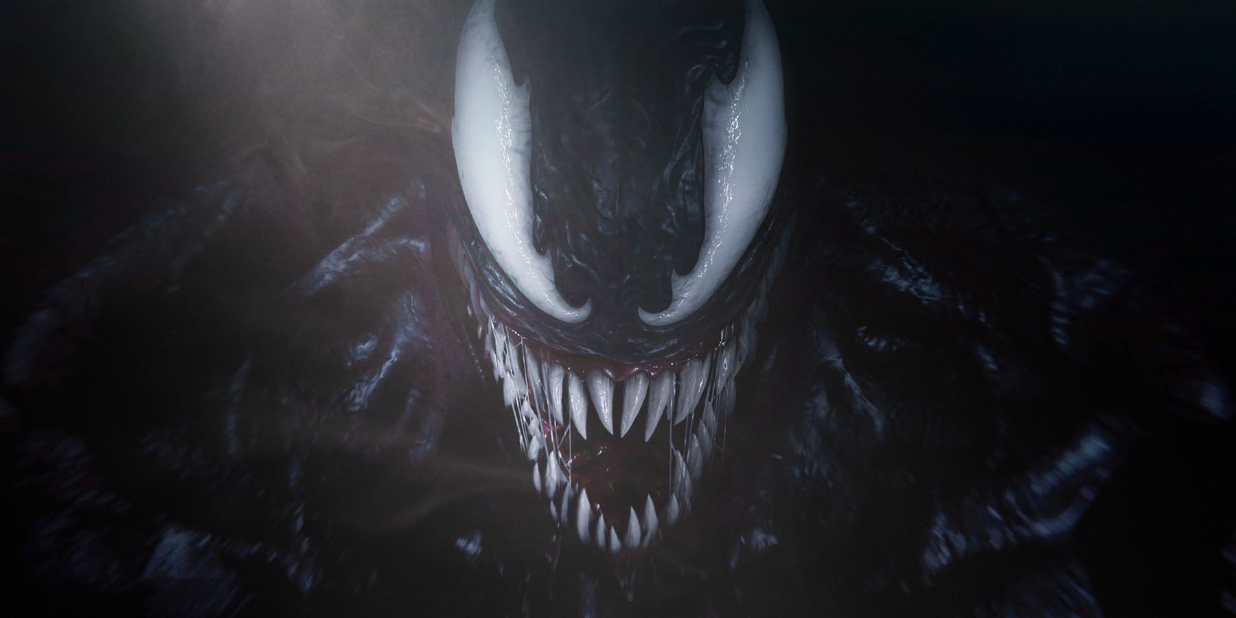A close-up screenshot of Venom emerging from the shadows in Marvel's Spider-Man 2.