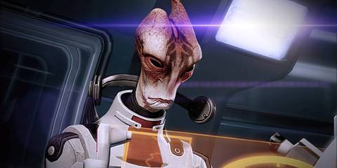 Mordin Solus from Mass Effect using a computer