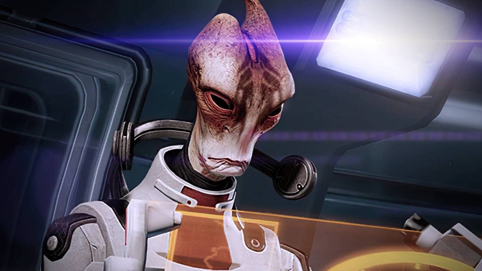 Mordin Solus from Mass Effect using a computer