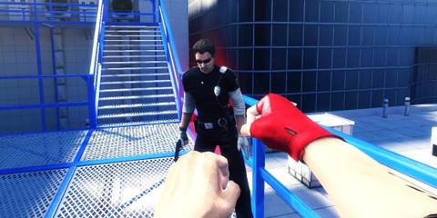 Punching an enemy holding a handgun on a rooftop