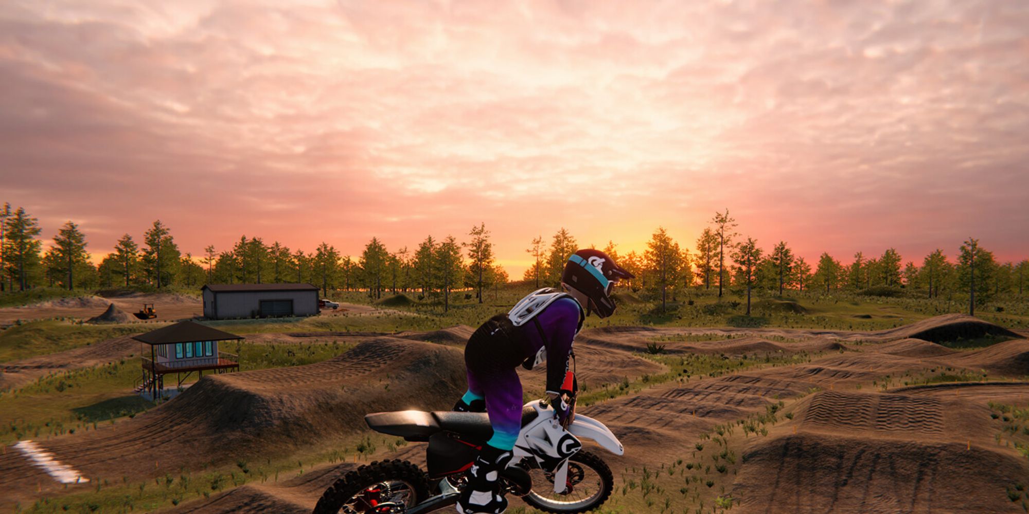 A rookie biker leaps over dunes in a motocross course