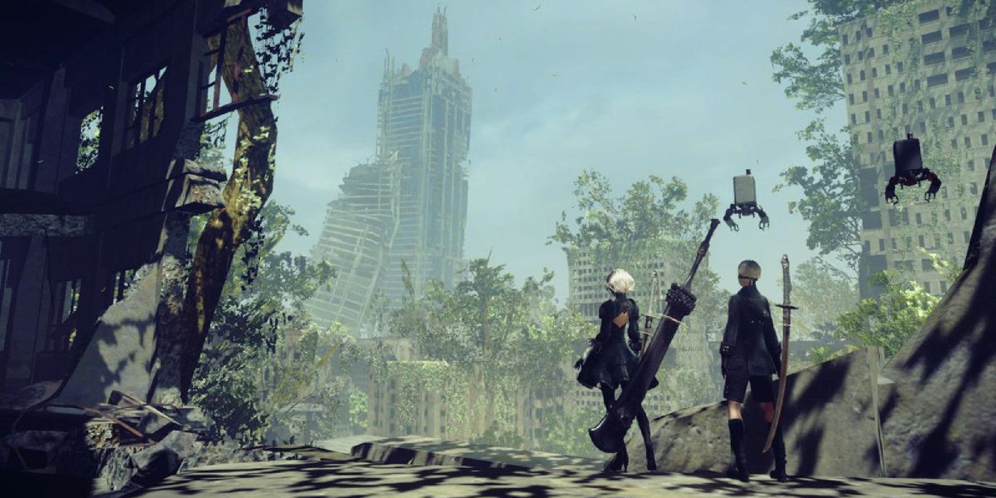 Wide shot of 2B and 9S overlooking dilapidated buildings of Earth which nature is slowly overtaking.