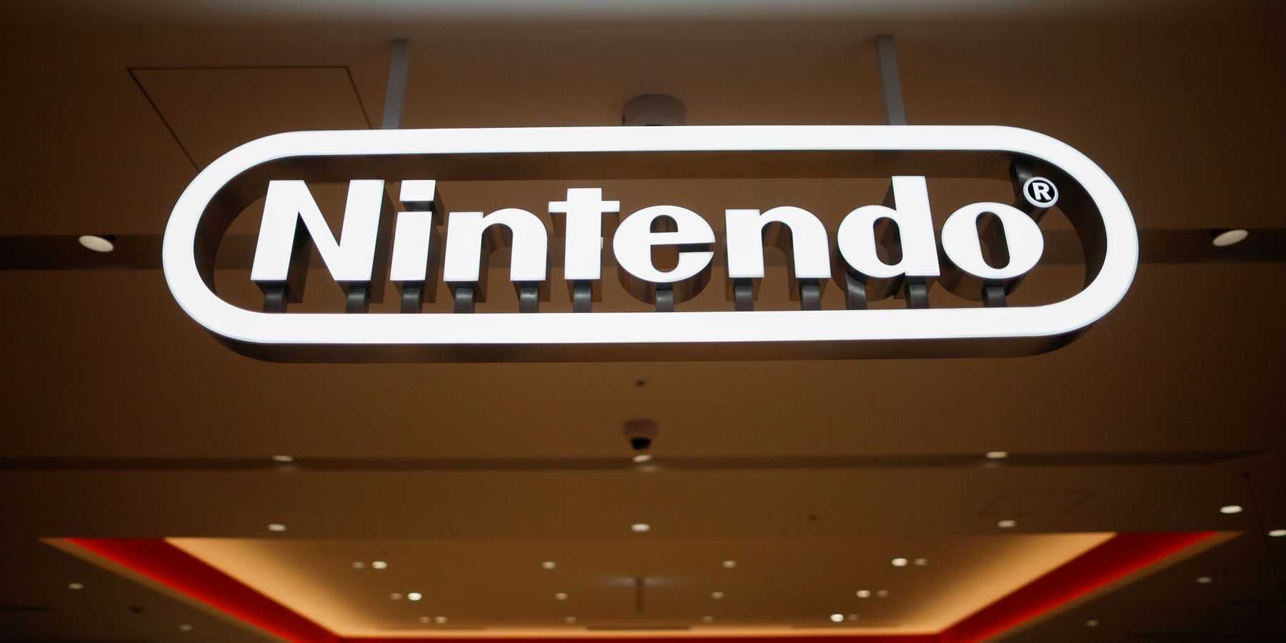A photo of a Nintendo logo sign over an entryway.