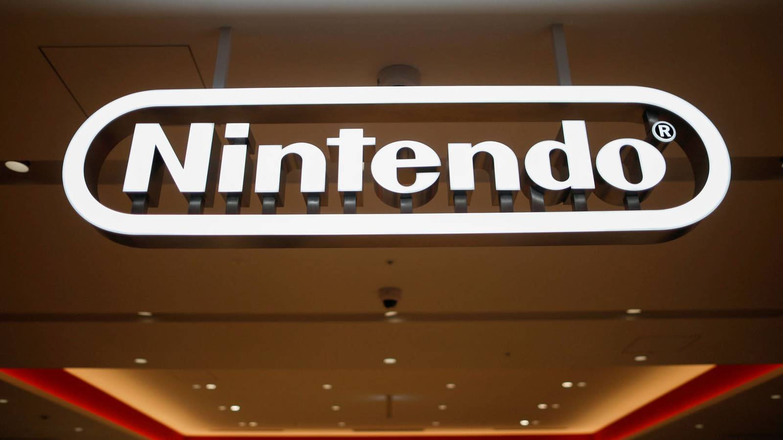 A photo of a Nintendo logo sign over an entryway.
