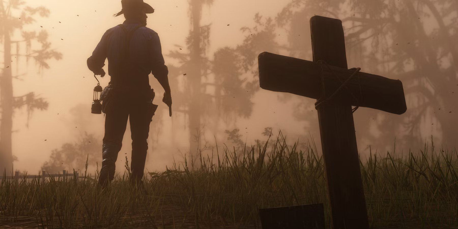 Arthur Morgan with his back to a grave in Red Dead Redemption 2