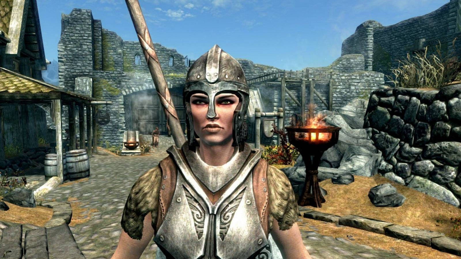 Lydia from Skyrim stood in the street in Whiterun.