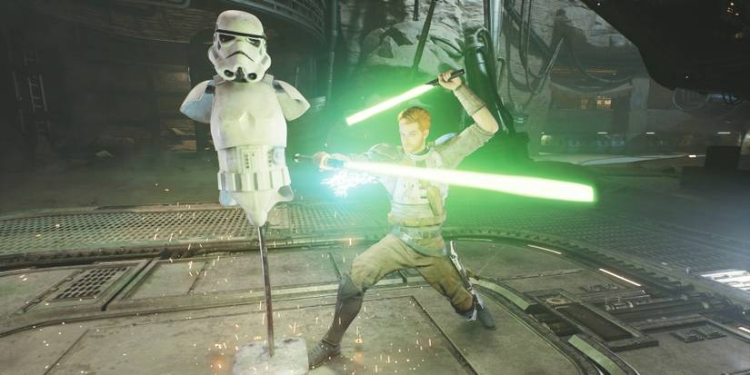 Cal Kestis training on a stormtrooper dummy while dual-wielding green lightsabers