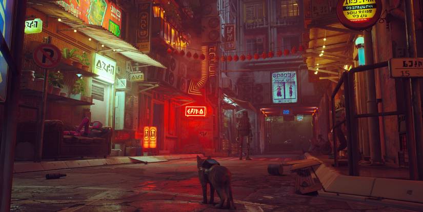 A ginger cat looking down a neon street where a robot stands in the game Stray
