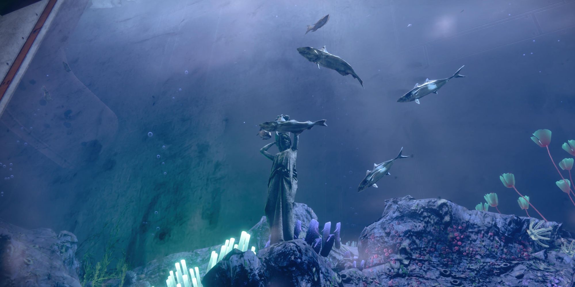 A player looking at a statue in water surrounded by fish in Destiny 2