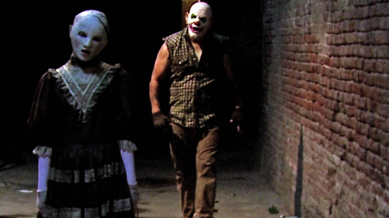 Two characters in masks in The Houses October Built