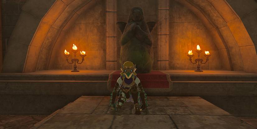 Zelda Tears of the Kingdom - Link Crouching In Front Of Emergency Shelter Lookout Landing Goddess Statue