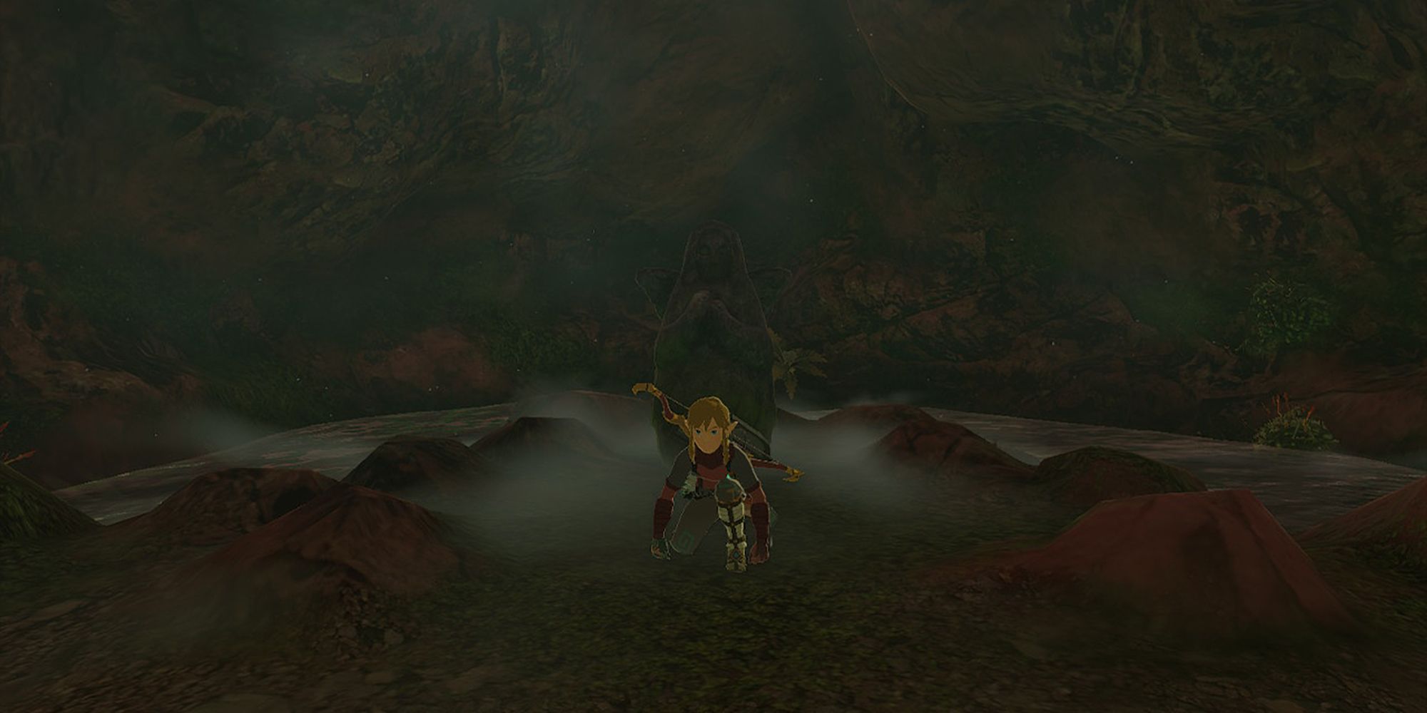 Zelda Tears of the Kingdom - Link Crouching In Front Of Goddess Statue Down The Well At East Akkala Stable