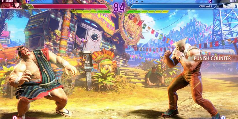 E. Honda getting hit by Guile's Sonic Boom