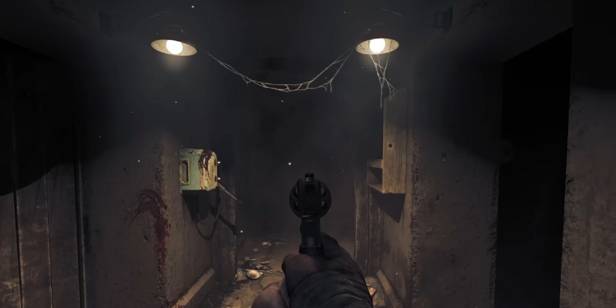 Henri levelling his gun down a dark corridor, ready for whatever might emerge from the dark.