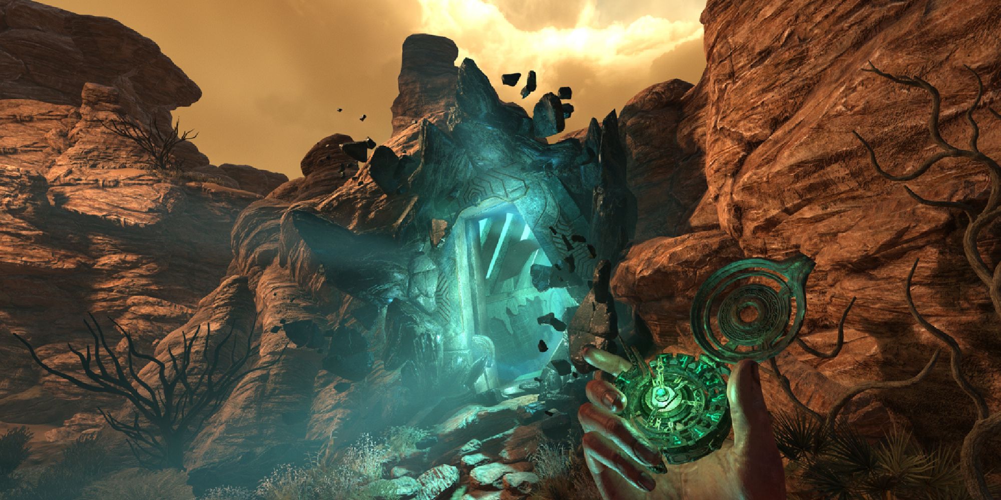 First person perspective of a rocky mountain path, leading to an entrance flowing with blue/green light, the main character holding some sort of compass. 