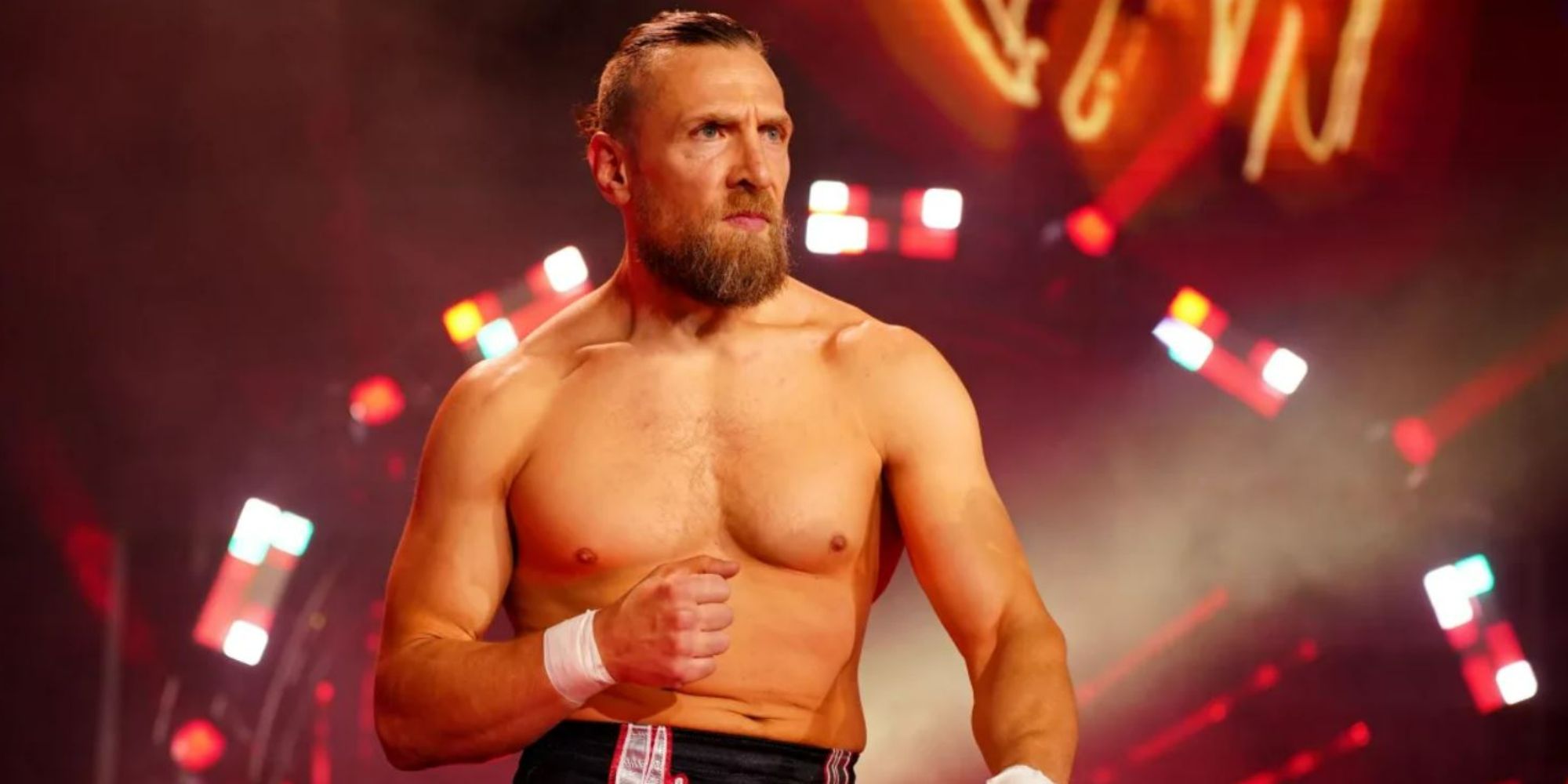 Former WWE and current AEW star Bryan Danielson walking to the ring with a clenched fist.