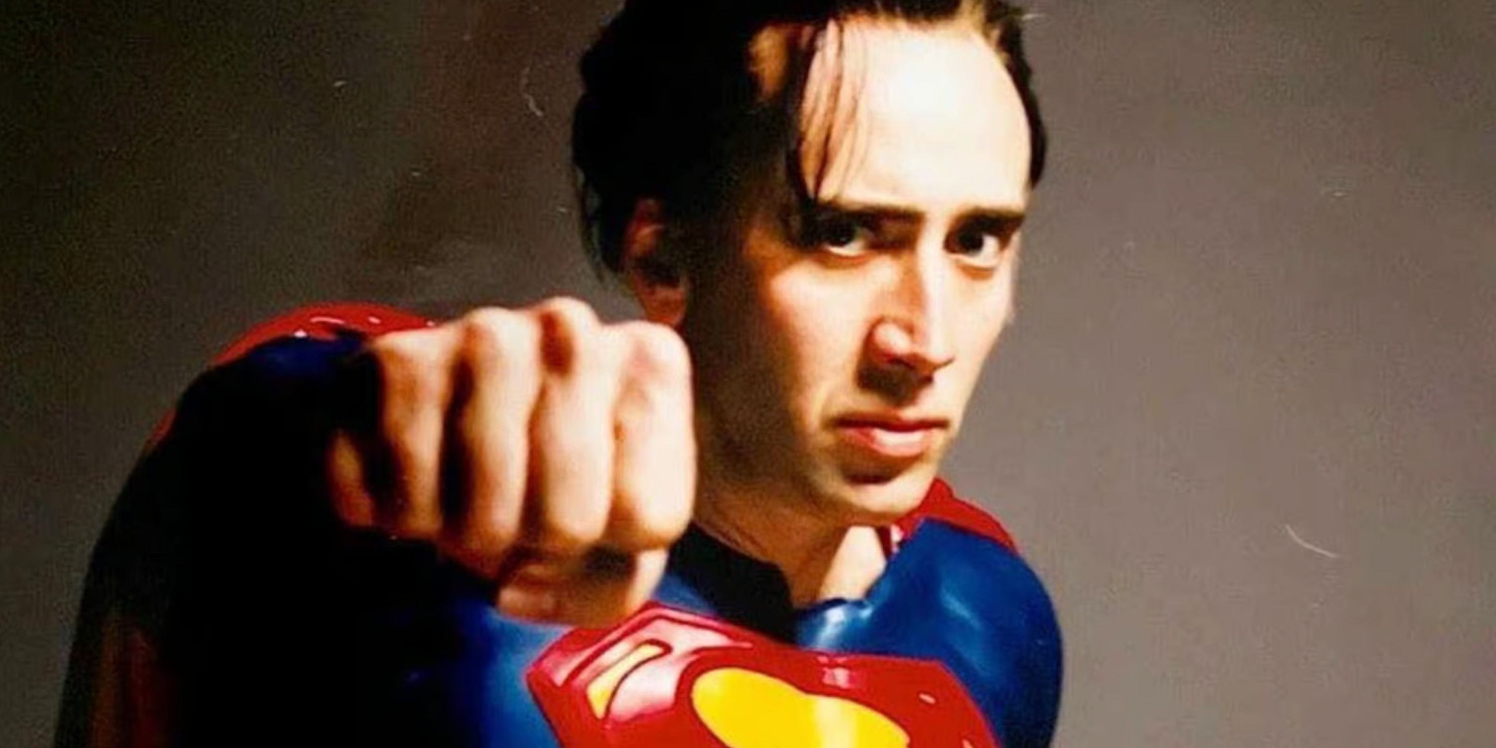nicolas cage as superman throwing a punch 