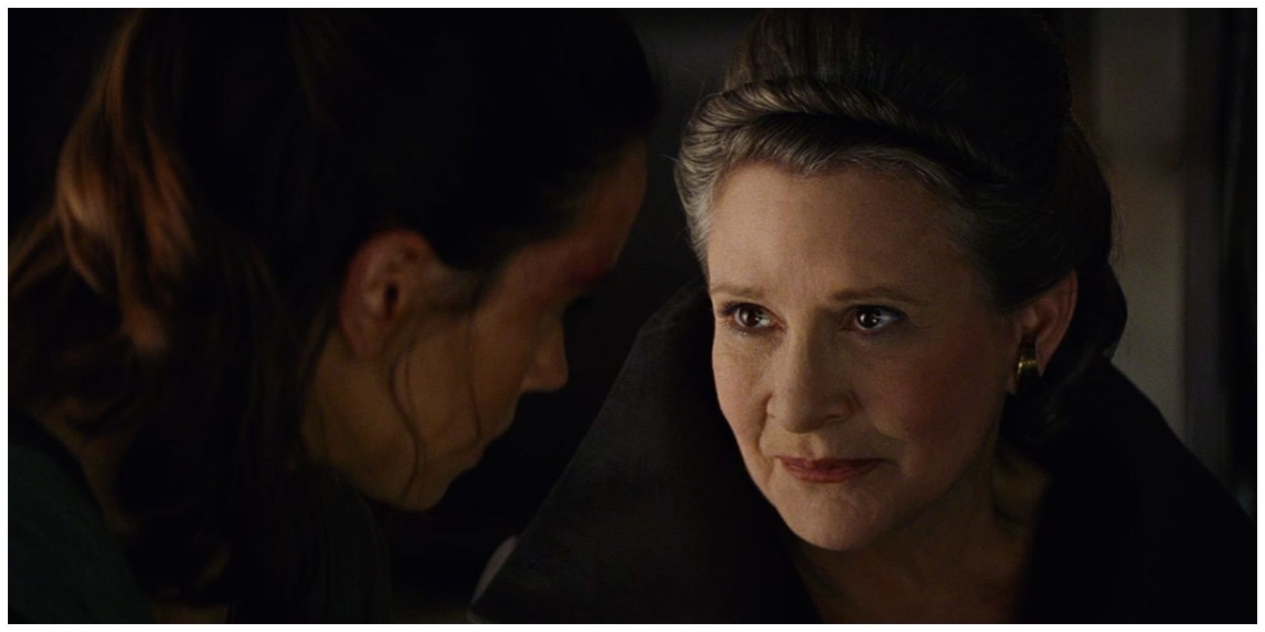 Daisy Ridley as Rey. Carrie Fisher as Leia Organa.